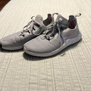 Light gray Nikes with tropical detailing